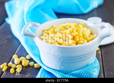 sweet corn in bowl and on a table Stock Photo