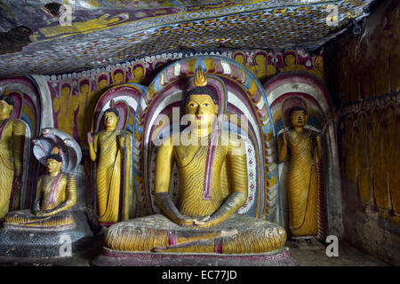 Ancient Buddha statues inside Dambulla Rock Temple in Sri Lanka Stock Photo