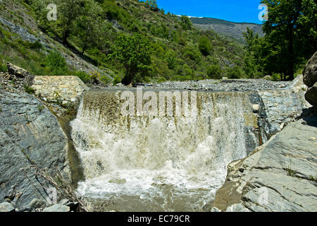 Barrage in the Poqueira river near Pampaneira, Alpujarra region, Andalusia, Spain Stock Photo