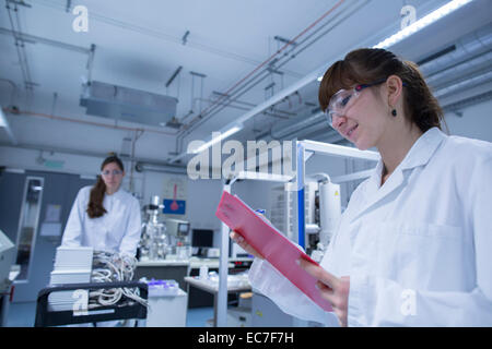 Two female technicans working in a technical laboratory Stock Photo