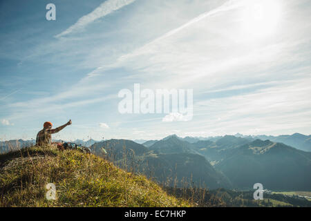 Austria, Tyrol, Tannheimer Tal, young man taking selfie in mountainscape Stock Photo