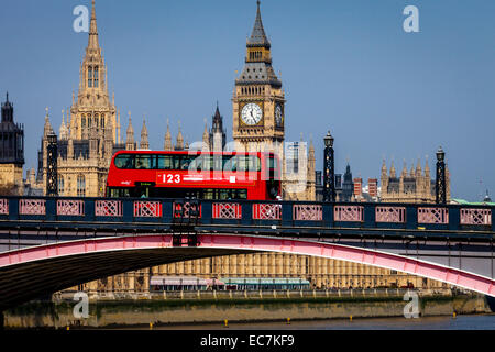 The Houses Of Parliament and Red London Bus Crossing Lambeth Bridge, London, England Stock Photo