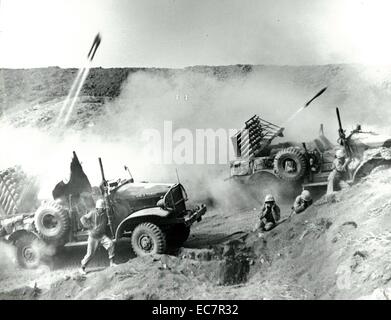 Photograph of International harvest trucks at Iwo Jima after navy barrage rockets hit. Dated 1945 Stock Photo