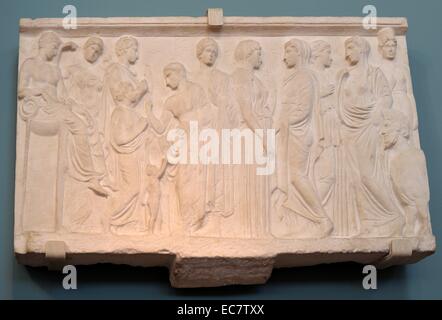 Votive relief to Kephisos. From New Phaleron, c 400 BC.  The relief was dedicated to the river god Kephisos by a woman called Xenokrateia.  Apollo sits on his tripod at the left and other unidentified gods stand in decorous poses.  Xenokrateia presents her little son to Kephisos. Stock Photo