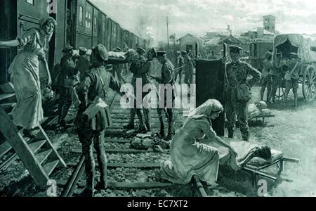 An ambulance train stops at a field hospital in France to offload wounded soldiers; world war one 1915 Stock Photo