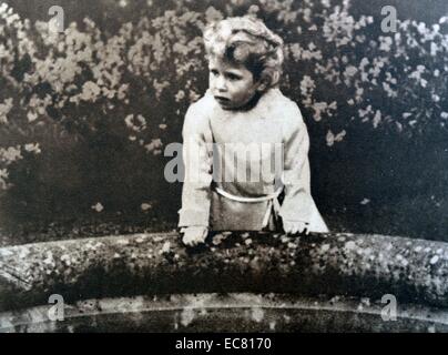 A Young Princess Elizabeth, later Queen Elizabeth II stands on a bridge in the Glamis Castle in Scotland, where both Princesses grew up. Stock Photo