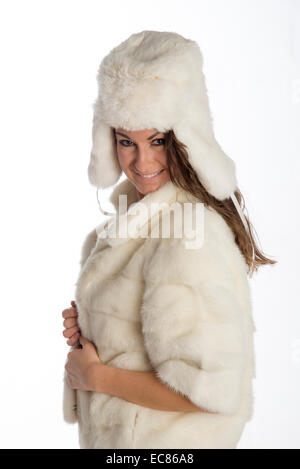 Woman wearing a white rabbit fur hat and a mink coat Stock Photo