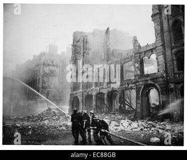 World War Two. London Fire Service fighting a burning building after ...