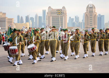 Qatar Army Forces are performing military music in Doha, Qatar. The event was held on Qatar National Day Stock Photo