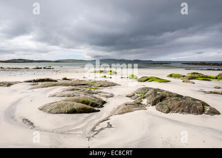 Rocks on empty sandy beach at Pol a Chara, South Uist, Outer Hebrides, Western Isles, Scotland, UK, Britain Stock Photo