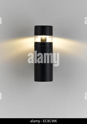 A modern wall lamp with lighting for decorate exterior, garden or walkway Stock Photo