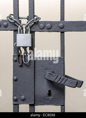 Iron gate scured with a chain and a padlock Stock Photo