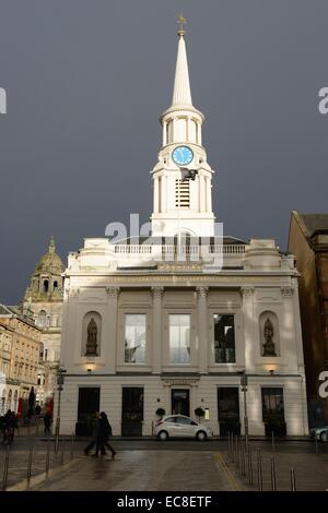 Glasgow Scotland, UK. 10th December, 2014. UK Weather: Thunder was heard round city centre streets as dark skys were interspersed with brief outbreaks of strong sunlight. These clouds brought a darkness to city streets. Stock Photo