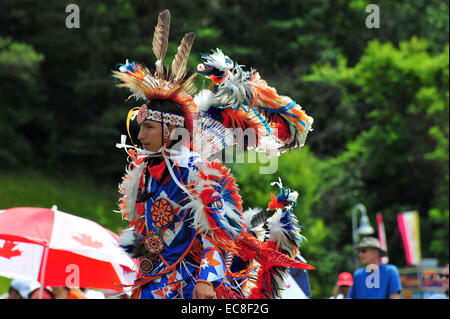 Indigenous Canadians dance during Canada Day celebrations held in a park in London, Ontario. Stock Photo