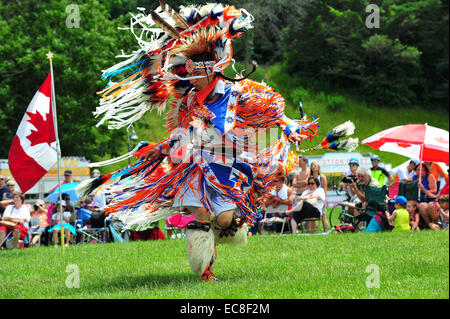 Indigenous Canadians dance during Canada Day celebrations held in a park in London, Ontario. Stock Photo