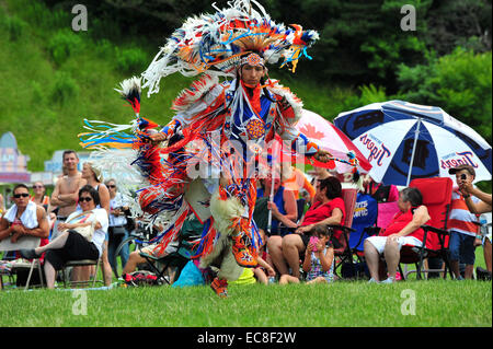 Indigenous Canadians dance during Canada Day celebrations held in a park in London, Ontario. Stock Photo