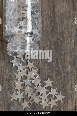 Christmas tree made of silver stars on a old wooden background Stock Photo