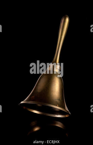 Hand Bell isolated on a black background Stock Photo