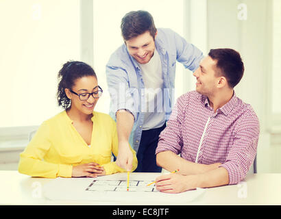 three smiling architects working in office Stock Photo