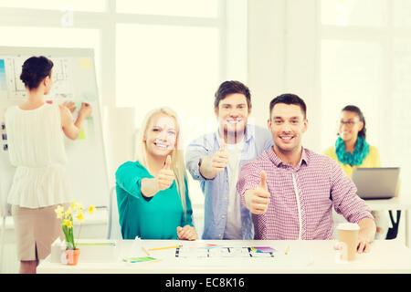 smiling interior designers working in office Stock Photo