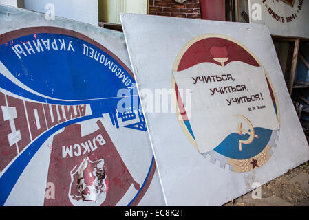 communist placards in Energetik Palace of Culture in Pripyat abandoned city, Chernobyl Exclusion Zone, Ukraine Stock Photo