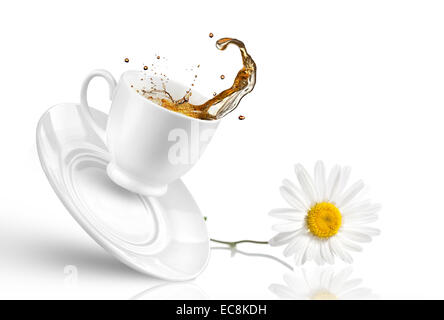 Splash of tea in the falling cup with flower isolated on white Stock Photo