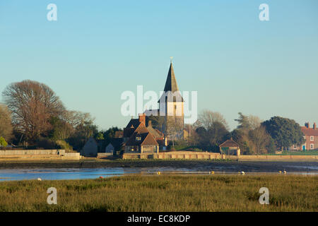 Bosham Church. Holy Trinity church in the picturesque village. View across the harbor on a winters day. Stock Photo