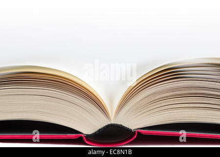 Closeup of a hardcover book open in the middle, isolated on white background, viewed from directly in front of. Copy space Stock Photo