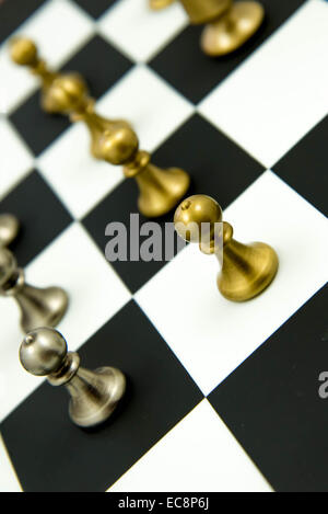 Classic chess game - pieces in play on chessboard Stock Photo