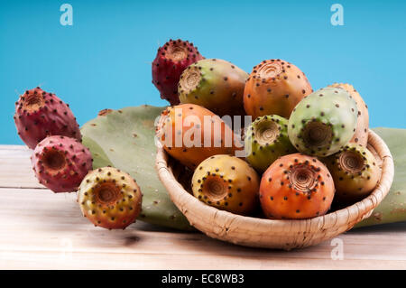 Tropical Opuntia Prickly Pear fruit on wooden background Stock Photo