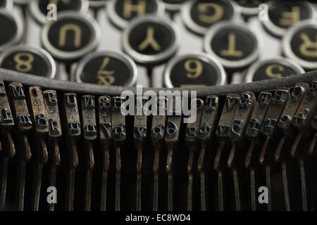 Underwood old fashioned vintage portable retro typewriter antique manual mass communication for letters blocked letter on arm Stock Photo