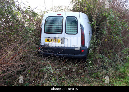 Small white van crashed into a hedge in rural Somerset, (number plate changed only) 10th December 2014 Stock Photo