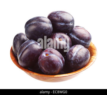 Sweet plums in bowl isolated on white background Stock Photo