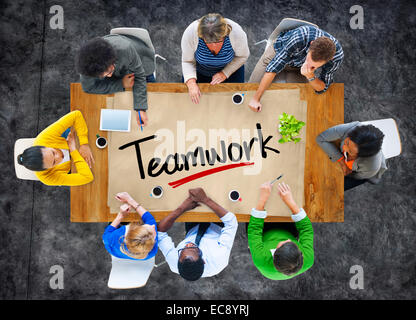 People in a Meeting and Single Word Teamwork Stock Photo