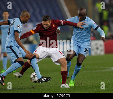 Rome, Italy. 10th December, 2014. AS Roma's Francesco Totti challanged by Manchester City's Eliaquim Mangala and Manchester City's Martin Demichelis during the Champions League Group E soccer match between As Roma and Manchester City at the Olympic Stadium in Rome. Credit:  Ciro de Luca/Pacific Press/Alamy Live News Stock Photo