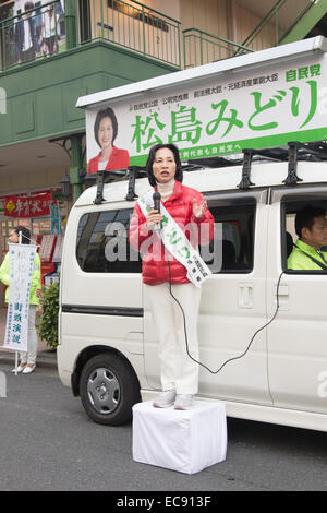 Tokyo, Japan. 10th Dec, 2014. Midori Matsushima, candidate of the ruling Liberal Democratic Party, speaks during a campaign for the December 14 lower house election in Tokyo on December 10, 2014. © AFLO/Alamy Live News Stock Photo