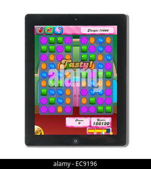 Playing Candy Crush on ipad, m01229