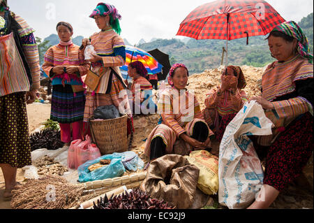 Flower Hmong selling produce at the Can Cau market. Stock Photo