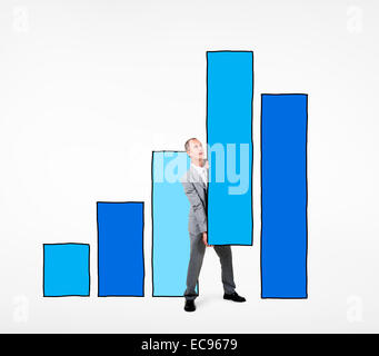 Businessman standing with a bar graph Stock Photo - Alamy