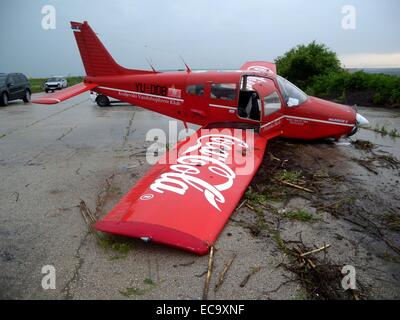 A Serbian registered Cesna aircraft crashed landed after it was forced to make an emergency landing due the strong winds and bad weather conditions. Three crew members have been reported injured and an investigation has been launched.  Featuring: Atmosphe Stock Photo