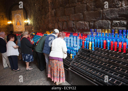 Prayer candles in Basilica of Santa Maria de Montserrat monastery in Catalonia, Spain. Stock Photo