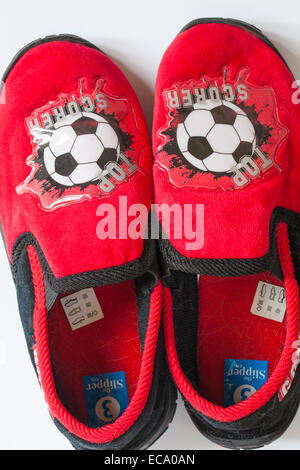 pair of Top Scorer boy's football slippers set on white background Stock Photo