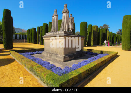 Statues of Queen Isabel, King Fernando and Christopher Columbus in the gardens of Alcázar de los Reyes Cristianos Stock Photo