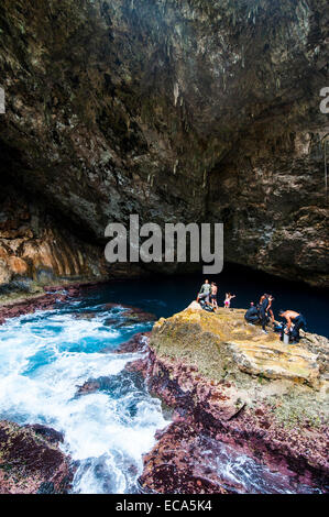 Divers preparing for their dive in the Grotto, a collapsed cave, Saipan, Northern Mariana Islands Stock Photo