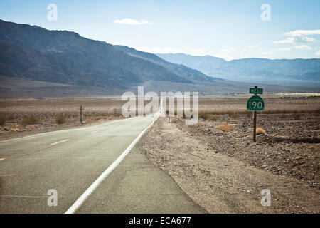 State Route crossing the desert landscape of Death Valley, California. Stock Photo