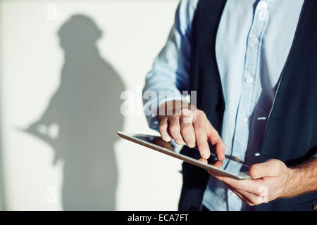 Male entrepreneur using digital tablet Stock Photo