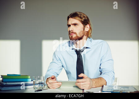 Young businessman working in office Stock Photo