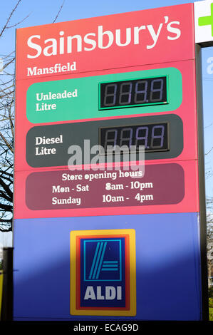 Mansfield, Nottinghamshire, UK. 11th December 2014. The average price of UK petrol has dropped below £1.20 a litre, its lowest level since December 2010, according to government figures. Mansfield supermarket fuel forecourts prices ,Cheapest Asda then Tesco ,Sainsburys and Morrisons .Unleaded £114.7       Diesel £119.7      . Credit:  IFIMAGE/Alamy Live News Stock Photo