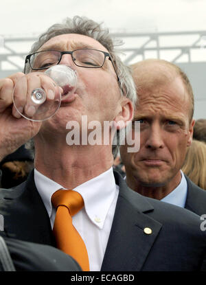 Lufthansa CEO Wolfgang Mayrhuber (L) and Airbus CEO Thomas Enders drink champagne to the distribution of the first A380 airplane of Lufthansa at the Airbus location in Hamburg, Germany, 19 May 2010. The Airbus A380 is called 'Frankfurt am Main', is 72 metres long and can host 526 passengers. The Lufthansa airplane will fly to Frankfurt Main with selected guests during the early afternoon to continue the celebrations. The first long-distance flight will be operated on 06 June 2010 to take the German national soccer team to the FIFA World Cup in South Africa. Photo: BORIS ROESSLER Stock Photo