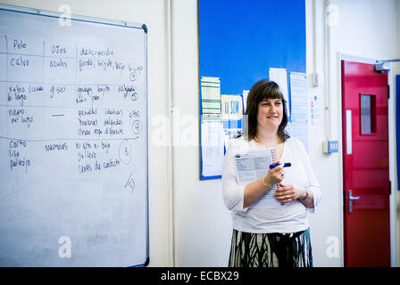 Female modern languages teacher teaching Spanish to a comprehensive school class in Cirencester,UK Stock Photo